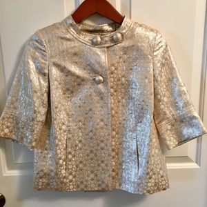 Champagne colored metallic jacket with pockets.